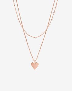 This layered necklace features a dainty shorty chain with a longer chain that has Heart Pendant. Materials: 14K yellow, rose or white gold plated Layered Necklace, Long Chain, Yellow Rose, Layered Necklaces, Heart Pendant, Gold Plate, Plating, Yellow Gold, White Gold