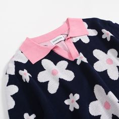 - Knitted Polo- 100% cotton yarn- Unlined- Regular fit- Machine washable Fabric & Care- Delicate Machine Wash at 30 degrees(86℉) with similar colors.- Iron inside out on low temperature.- Store flat.- Do not tumble dry.- Do not bleach. Blue Floral Print Tops For Winter, Blue Floral Print Top For Winter, Winter Blue Floral Print Tops, Blue Graphic Print Polo Collar Top, Luxury Blue Knit Polo Sweater, Designer Blue Cotton Polo Shirt, Blue Graphic Print Polo Shirt, Winter Floral Print V-neck Top, Long Sleeves Polo