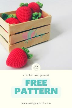 crocheted strawberries in a wooden crate with text overlay that says free pattern