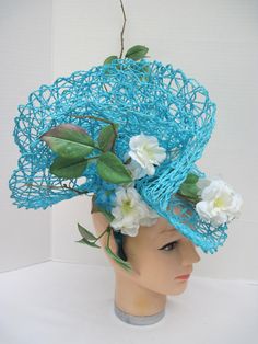 "* This design sits off to the side of the head allowing it to be worn on either the right or left side. One side features more of the white flowers and the other side has more of the folding. * The hat form is 14\" in diameter with a light weight weave and designed with white silk Wild Roses. Tiny turquoise daisy like flowers pick up the color in the hat forms. * It is light weight, balanced and comfortable to wear and upon ordering you will receive this exact fascinator. * Designed on a wide a Spring Turquoise Fitted Fascinator, Turquoise Fascinator For Spring Wedding, Turquoise Headpieces For Spring Weddings, Spring Wedding Turquoise Headpieces, Hat Form, Tiki Dress, Ladies Luncheon, Fancy Hats, Mannequin Heads