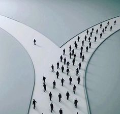 a group of people walking across a white bridge