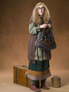 a woman standing next to a suitcase with information about her clothing and name on it