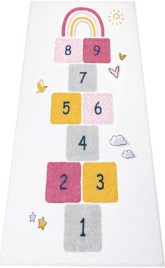 a child's play mat with numbers and rainbows