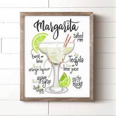 a framed margarita sign hanging on the wall