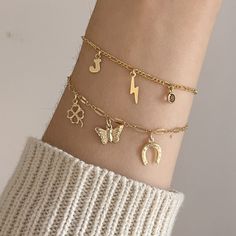 Lucky Charm Bracelet - Gold Filled Lucky Charm Bracelet - Butterfly Charm Bracelet - Good Luck Charm Bracelet  14k Gold Filled - Hypoallergenic - Handcrafted - Waterproof - Sustainably Made.  Dainty 14k gold filled charm bracelet with 3 14k gold filled charms: 1 four leaf clover charm, 1 butterfly charm, and 1 horsehsoe charm.  These make such a cute gift! Choose your size. Gold-plated Charm Bangle Bracelets, Gold Charm Bangle Bracelet, Adjustable Gold Chain Bracelet With Charms, Gold Chain Bracelet With Charms And Adjustable Fit, Gold Bangle Charm Bracelet, Symbolic Yellow Gold Bracelets With Charms, Symbolic Yellow Gold Bracelet With Charms, Hypoallergenic Gold Plated Charm Bracelet, Symbolic Gold Bracelets With Charms