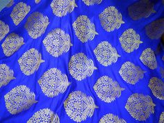 2.5 Meter Royal Blue Brocade Fabric Banarasi Fabric Banaras Brocade Art Blended Silk for Wedding Dress Bridesmaid Lehenga Brocade fabric. This is a beautiful blended benarse silk brocade floral design fabric in Royal Blue and Gold. The fabric illustrate golden woven beautiful design on Royal Blue background. ➤Product: Brocade Fabric ➤Fabric Type: Blended Silk (Viscose and Silk) Fine quality Zari Brocade Weaving from Banaras ➤Color: Royal Blue and Gold ➤Width: 44 inches. ➤Condition: New ➤ Code: b Banarasi Fabric, Wedding Dress Bridesmaid, Royal Blue Background, Bridesmaid Lehenga, Sequin Saree, Brocade Skirt, Silk Wedding Dress, Royal Blue And Gold, For Wedding Dress