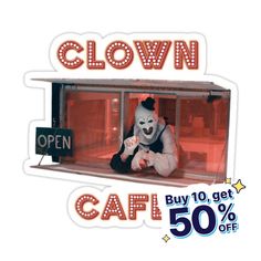 the clown is sitting on the window sill for sale