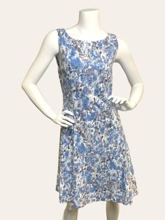 Get ready to turn heads in the Maggie Sleeveless Dress! This stunning dress features a beautiful floral print design and is crafted from a stretchy, comfortable fabric that will keep you feeling great all day long. Perfect for any occasion, this dress will make you look and feel your best. Details: Not lined Fabric content: 66% Viscose, 30% Nylon, 4% Elastane Care: Hand wash cold Made in Canada Sleeveless Blue Dress Stretch Mini Dress With Floral Print, Fitted Sleeveless Floral Sundress, Fitted Sleeveless Floral Print Dress, Sleeveless Floral Print Dress, Fitted Sleeveless Dress With Floral Print, Floral Print Sleeveless Sundress, Knee-length, Sleeveless Stretch Midi Dress With Floral Print, Sundress With Floral Print A-line Shape, Floral Print A-line Sleeveless Sundress