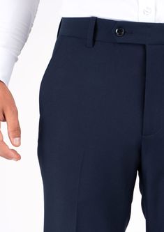 Cut from a stylish stretch cotton fabric, the Navy Blue Pants are a modern take on a versatile style. Pairing well with a wide variety of outfits, these pants will quickly become a go to favorite. Navy Classic Stretch Bottoms, Classic Navy Stretch Bottoms, Navy Fitted Elastane Pants, Navy Fitted Elastane Bottoms, Navy Slim Fit Pants For Business Casual, Navy Stretch Pants For Business Casual, Blue Slim Fit Elastane Bottoms, Blue Tailored Cotton Pants, Tailored Blue Cotton Pants