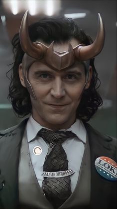 a man in a suit and tie with horns on his head