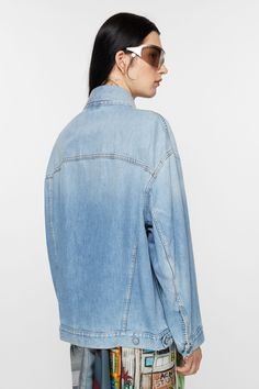 Denim jacket is cut to an oversized unisex fit with dropped shoulders, extra long sleeves and a hip length. Crafted from non-stretch denim in a light blue wash. FN-UX-OUTW000016 Oversized Medium Wash Denim Jacket, Oversized Spring Shacket For Streetwear, Oversized Light Wash Outerwear For Streetwear, Oversized Light Wash Denim Jacket For Spring, Oversized Washed Blue Denim Outerwear, Oversized Denim Outerwear In Washed Blue, Oversized Light Wash Denim Outerwear, Oversized Medium Wash Shacket For Spring, Trendy Oversized Light Wash Denim Jacket