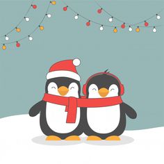 two penguins wearing hats and scarfs standing next to each other