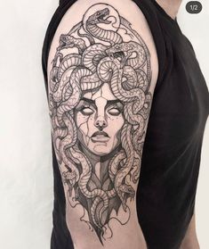 a woman's head with snakes on her arm