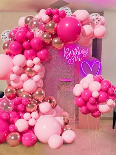 pink and gold balloons in the shape of a house