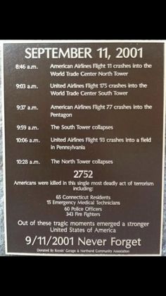 a plaque on the side of a building that reads,'november 11, 2011 american airlines flight crash into the world trade center north tower