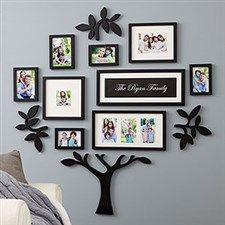 a family tree with many pictures hanging on the wall