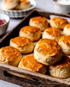 some biscuits in a wooden tray on a table