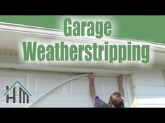 the garage weather striping system is installed in front of a white garage door with green lettering