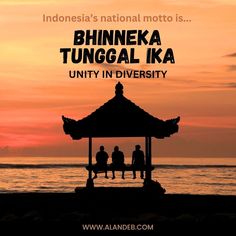 the silhouette of three people sitting on top of a gazebo in front of an ocean