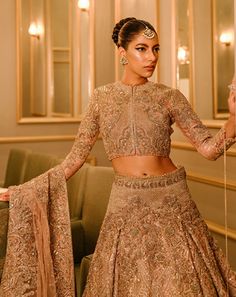 Bollywood Style Embroidered Reception Sets, Bollywood Embroidered Sets For Reception, Elegant Designer Lehenga With Gold Embroidery, Reception Embroidered Chinon Sets, Embroidered Chinon Sets For Reception, Semi-stitched Sets With Gold Embroidery And Traditional Drape, Raw Silk Anarkali Wedding Set, Festive Brocade Choli With Intricate Embroidery, Traditional Gold Art Silk Gown