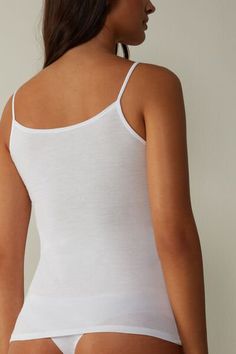 Vest top with skinny straps in ultrafresh Supima® cotton. The premium quality fibre is incredibly soft and breathable, providing excellent stretch while containing no elastane. Elegant Seamless Cotton Tank Top, Seamless Spaghetti Strap Tank Top For Daywear, Elegant Cotton Tank Top With Adjustable Straps, Elegant Cotton Tank Top, Elegant Cotton Camisole With Adjustable Straps, Seamless Cotton Camisole With Wide Straps, Cotton Seamless Camisole For Daywear, Elegant Cotton Tank Top With Spaghetti Straps, Stretch Cotton Camisole With Delicate Straps