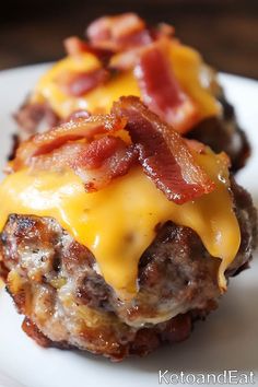 two hamburger patties covered in cheese and bacon