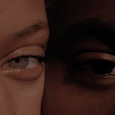 an image of two people with their eyes close together