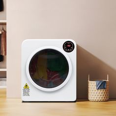 a washing machine sitting on top of a wooden table