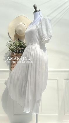 a white dress and hat are on display