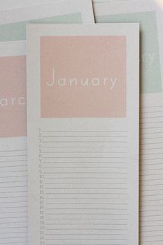 three pink and green lined paper with the word january written on one side in white