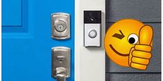 an emoticive smiley face is on the front door of a house with a smart lock