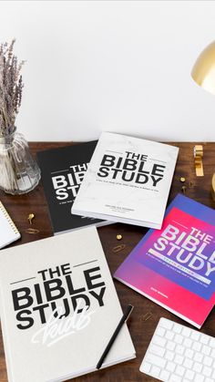 the bible study book is sitting on a desk next to a keyboard and mouse