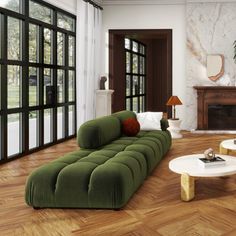 a living room filled with lots of furniture next to a fire place and large windows