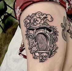 a woman's leg with a tattoo on it