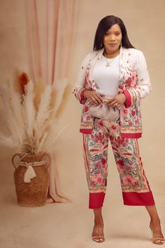 This floral pant suit is a stunner and not your basic suit pant set. With its versatility, our "Serena Floral Set" allows for endless styling options. Wear the set together for a coordinated look that exudes effortless style, or mix and match the pieces with other items in your wardrobe for even more versatility. Pair the crop top with high-waisted skirts or jeans for a trendy and flirty ensemble, or style the pants with a tucked-in blouse for a sophisticated and polished look. PRODUCT DETAILS: Spring Brunch Sets With Floral Print, Elegant Floral Print Pant Set For Summer, Feminine Spring Workwear Sets, Elegant Workwear Pantsuit With Matching Set, Spring Workwear Set With Floral Print, Spring Workwear Pants Matching Set, Formal Floral Print Sets For Spring, Elegant Floral Print Pant Set For Spring, Floral Print Sets For Workwear