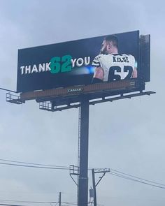 a large billboard with a football player on it that says thank to you for the game