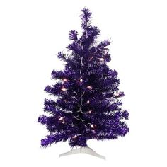 a purple christmas tree with white lights on it