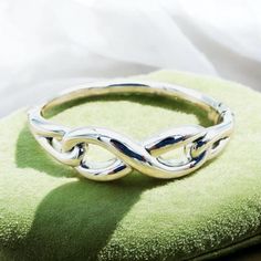 Elevate your accessory collection with our exquisite 925 Sterling Silver Infinity Bangle Bracelet. This sophisticated piece features a spring hinge for effortless wear and is designed to provide both style and comfort. With a delicate weight that ensures ease of movement, this bangle boasts an inside circumference of 6.5 inches or 16.5 centimeters, making it a perfect fit for a variety of wrist sizes. Each bangle is meticulously crafted and bears the hallmark "925," signifying its authenticity a Silver Bracelet With Modern Twist For Anniversary, Sterling Silver Hinged Bracelet For Gift, Modern Twist Sterling Silver Bracelet For Gift, Modern Twist Sterling Silver Bracelet As Gift, Modern Twist Sterling Silver Bracelet Gift, Sterling Silver Hinged Jewelry Gift, Sterling Silver Hinged Jewelry For Gifts, Unique Birthday Ideas, Infinity Design