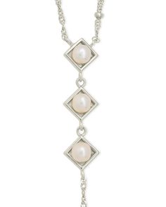 Introducing the Reine Lariat Necklace, a luxurious piece crafted for the sophisticated individual. This elegant necklace features a delicate beaded chain adorned with lustrous pearls, exuding an air of exclusivity and refinement. Elevate any outfit with the timeless style and grace of the Reine Lariat Necklace. Material: 14K gold or rhodium plated brass, freshwater pearls Features: Measures 16" with 2" extender, 3.75" drop, 0.35" pendants, 5mm pearls, 2mm chain, Lead & Nickel free, lobster clasp Sterling Silver Lariat Pearl Necklace, Elegant Pearl Charm Dangle Lariat Necklace, Elegant Pearl Charm Lariat Necklace With Dangle, Elegant Lariat Necklace With Pearl Charm Dangle, Sterling Silver Lariat Pearl Necklace With Pendant, Elegant Sterling Silver Lariat Necklace With Pearl Pendant, Formal Pearl Lariat Necklace, Elegant Pearl Lariat Dangle Necklace, Elegant Dangle Lariat Necklace With Pearl Pendant