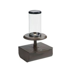 a glass and metal device on a stand