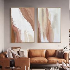 a living room with two paintings on the wall