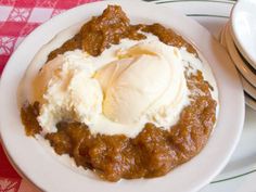 a white plate topped with ice cream and chili