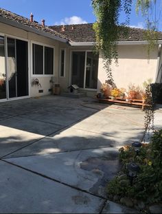 a house with a large patio in front of it