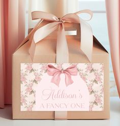 a gift box with a pink bow and name on it that says, madison's fancy one