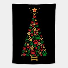 a christmas tree made out of paw prints on a black background with a star above it