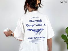 Embrace comfort and faith with our vintage-inspired Christian Comfort Colors® T-Shirt.  Featuring the powerful proverb from Isaiah 43:2, 'When you go through deep waters, I will be with you,' its large back graphic and subtle front print offer a stylish reminder of unwavering support through life's challenges. Wrap yourself in spiritual strength--a perfect gift for Christians seeking comfort and inspiration. * K E E P * S H O P P I N G *   ✺ Shop our entire Quite Nice Studios collection here: https://www.etsy.com/shop/QuiteNiceStudio * Q U I C K * F A C T S * ✺ 100% preshrunk cotton ✺ Wash (inside out) and dry normally (on cool for best results) * S I Z I N G * ✺ Sizing is unisex so runs like men's, though not overly large ✺ Most women Xfind their typical size works best, since they are me Cute Christian Tshirt, Christian Comfort, Christian Crewneck, Christian Graphic Tees, Christian Tshirt Design, Spiritual Strength, Whale Shirt, Isaiah 43, Christian Tshirt