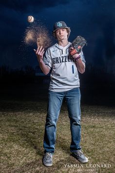 a baseball player throwing a ball in the air with his mitt and glove on