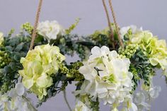 flowers are hanging from twine with rope