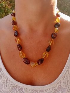 Real Amber jewelry gemstone large beads necklace multicolor Natural Baltic amber stone beaded necklace for women handmade jewelry yellow cognac amber gemUnique jewelry 1 piece you are buying a necklace, what is in the photo50 cm - 19/70 inch32 gramsBeautiful necklace made of natural Baltic amber of different colors,amber jewelry for women, buy for yourself, mother, wifeIt looks great on both a loose boho style and classic dresses and shirts.For every day, holiday, to the office for work.The beads are collected on a strong nylon thread through a knot.Some beads have small natural irregularities, this is not a defect, but confirmation that the amber is 100%%20real                                           HOW TO CARE FOR YOUR BALTIC AMBER JEWELRYBecause amber is soft and can be brittle, it i Classic Dresses, Large Beads