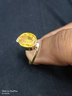 Yellow sapphire, also known as "Pukhraj" in Hindi, is a gemstone that belongs to the corundum family, just like blue sapphire. It is the yellow variety of corundum and is valued for its vibrant yellow color. Yellow sapphire is composed of aluminum oxide (Al2O3) with traces of iron that give it its yellow hue. The color of yellow sapphire can range from pale yellow to intense golden yellow. The most prized and valuable yellow sapphires typically exhibit a pure, vibrant yellow color without any hi